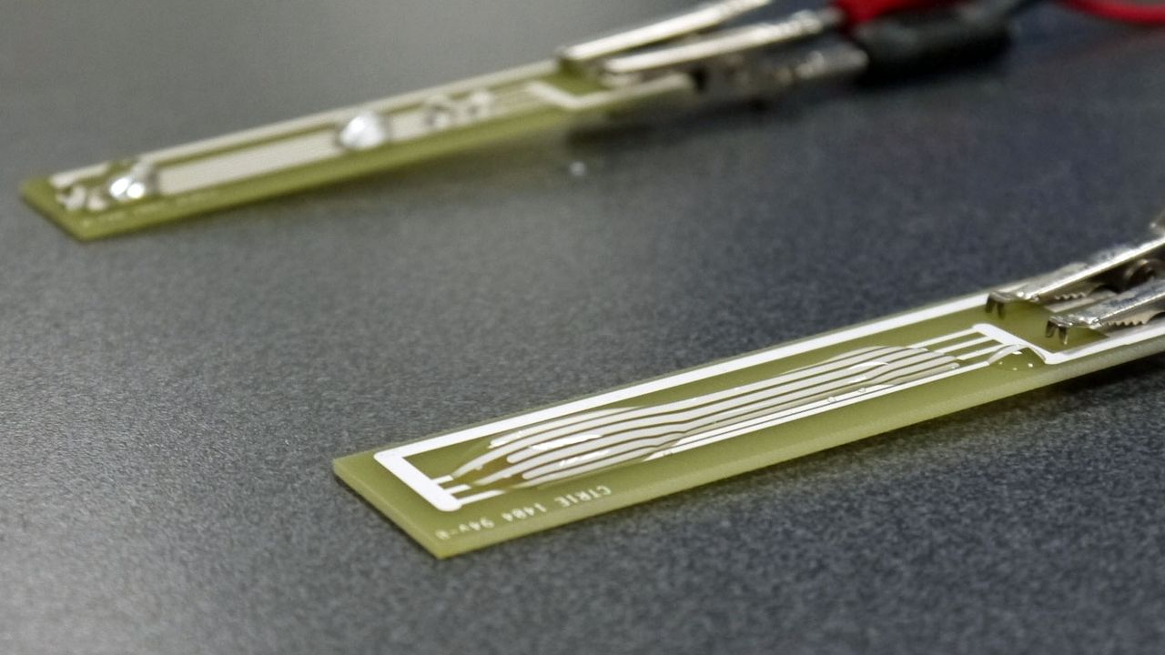 Water spreads out on an untreated circuit board