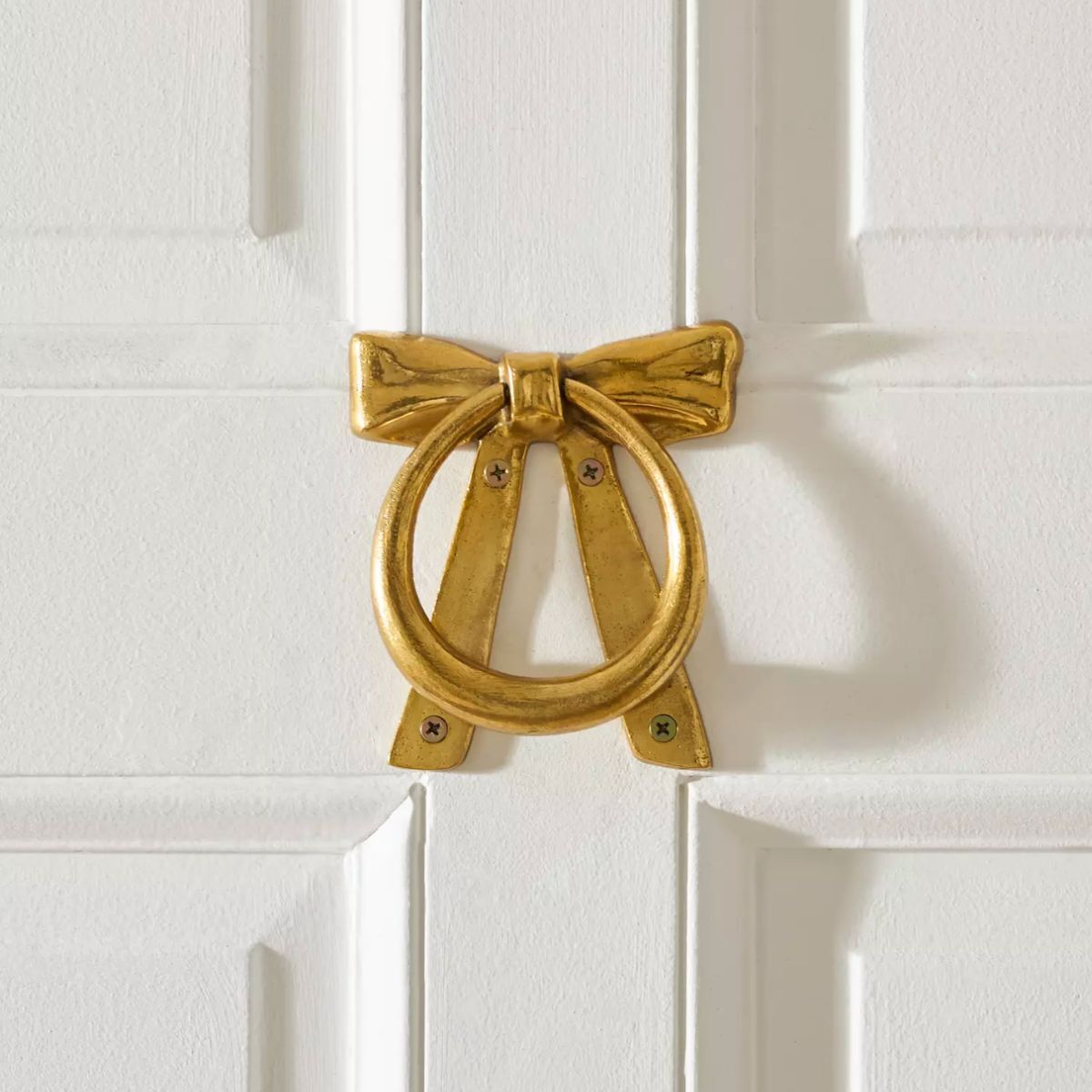 A bow shaped door knocker
