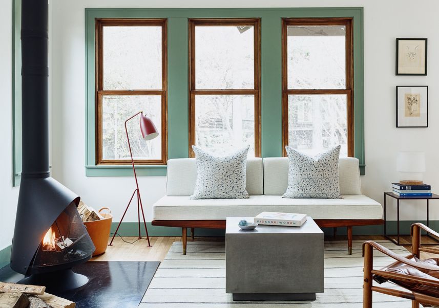 A living room with dark trim and white walls