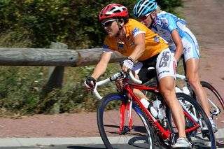 Diana Ziliute (Safi) takes a corner as the bunch chases the American escapee, Alison Starnes.