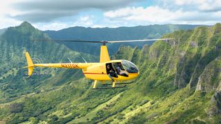 Donn Delson photographing from a helicopter