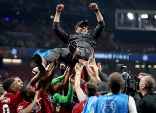 Jurgen Klopp was lifted by Liverpool's players after the game