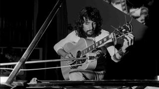 Cat Stevens playing guitar in the 1970s