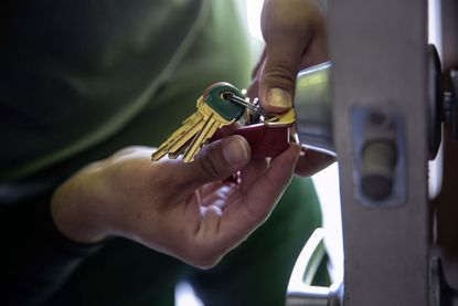 Man holding apartment keys.