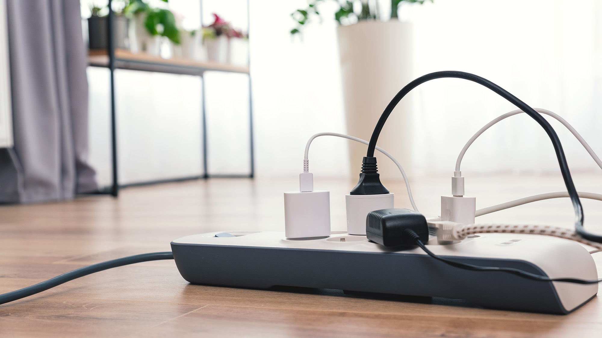 Power strip on wooden floor