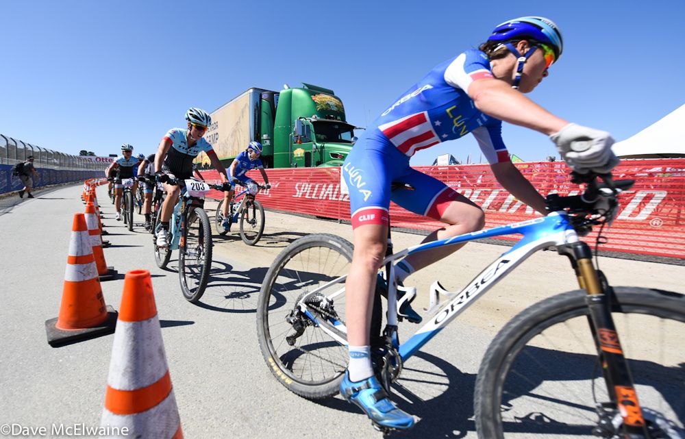 Georgia Gould (Luna Pro Team) pulls a long train of riders back onto the racetrack.