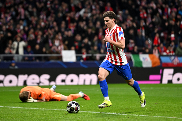 Julian Alvarez of Atletico Madrid scores his team's third goal vs Tottenham Hotspur in the Champions League