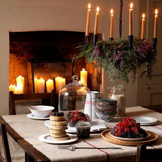 rustic christmas dining room with glass bell jar fireplace candles