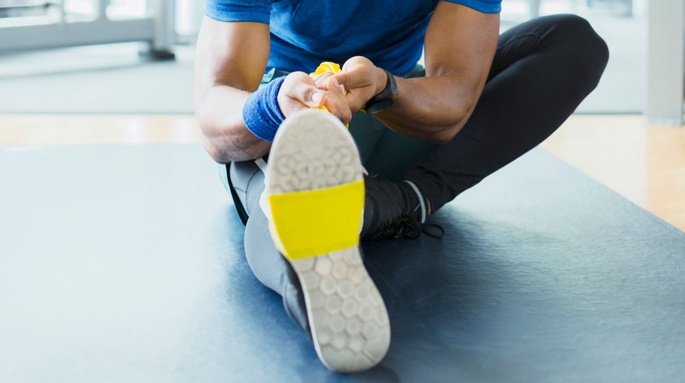 Man stretches calf