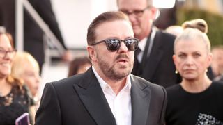 Rickey Gervais at a Golden Globe Awards ceremony with his partner Jane Fallon