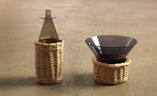 Characterful glass vessels in wooden baskets