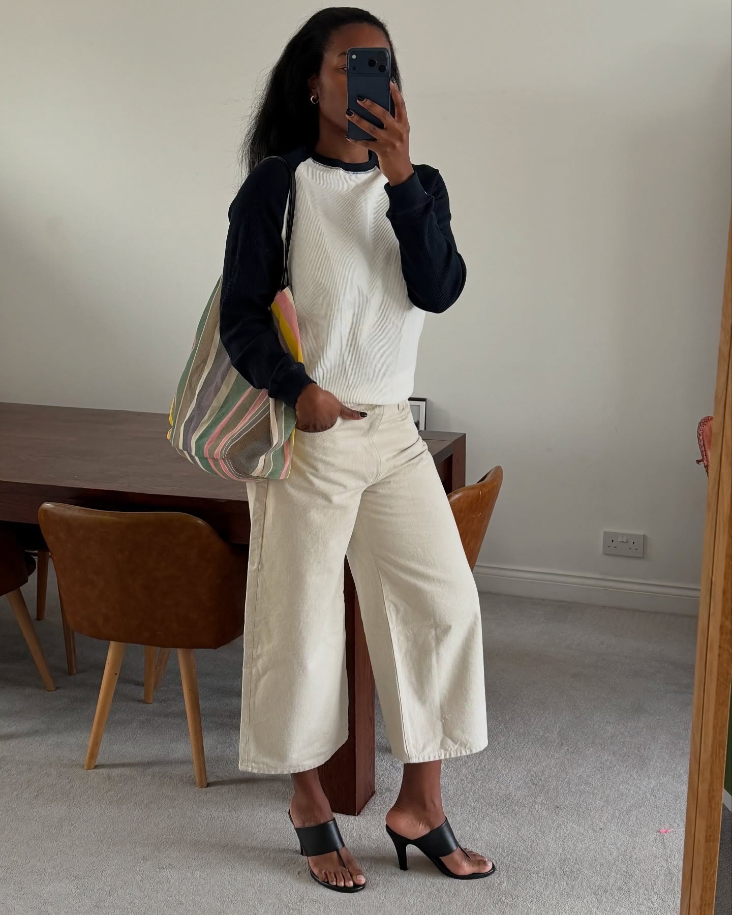 Woman wearing highwater jeans, a spring 2026 jean trend.