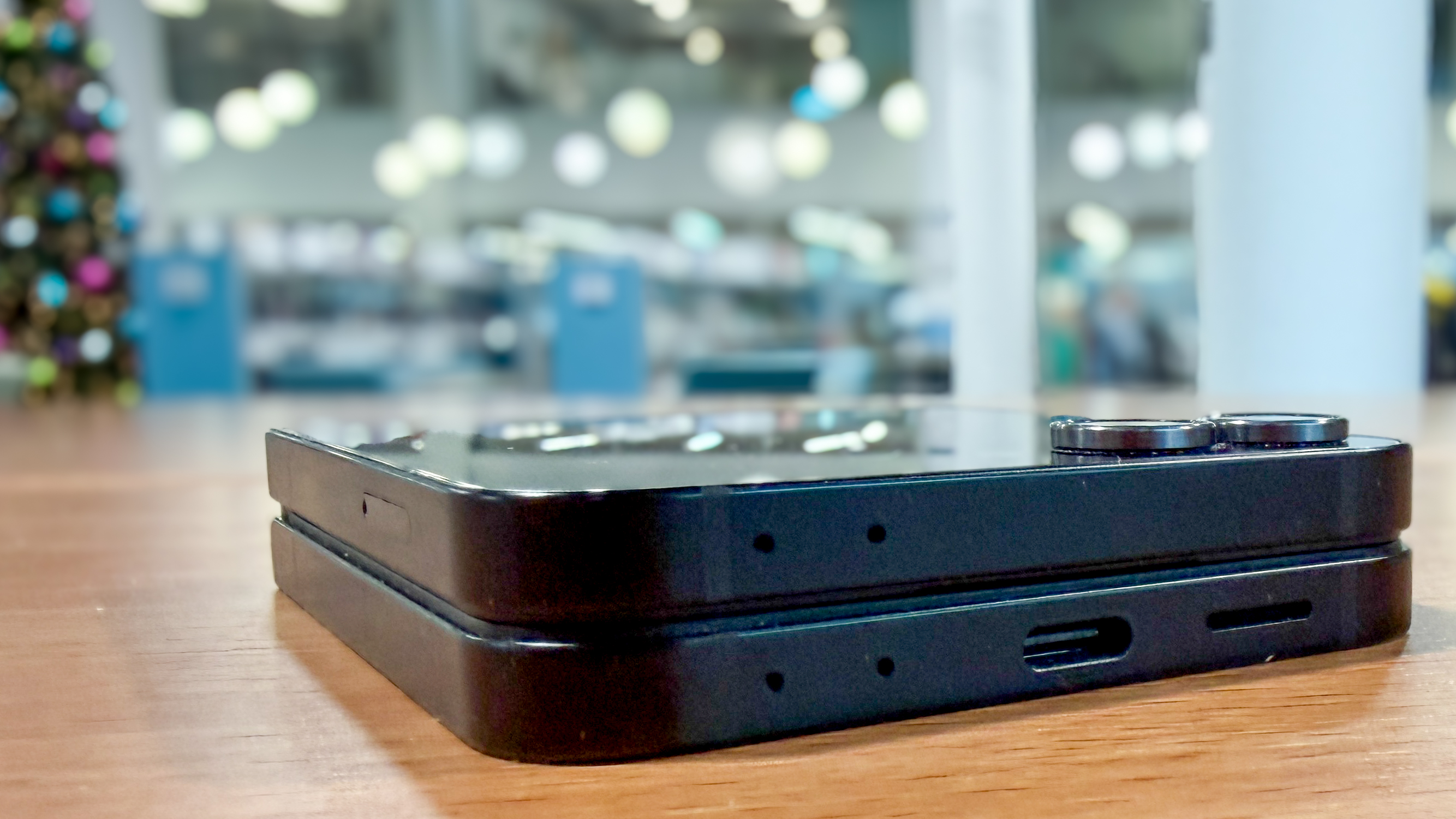 Samsung Galaxy Z Flip 7 FE in piano black color showing content on the cover display and the main screen