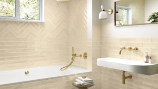 cream bathroom tiles around a built in bath