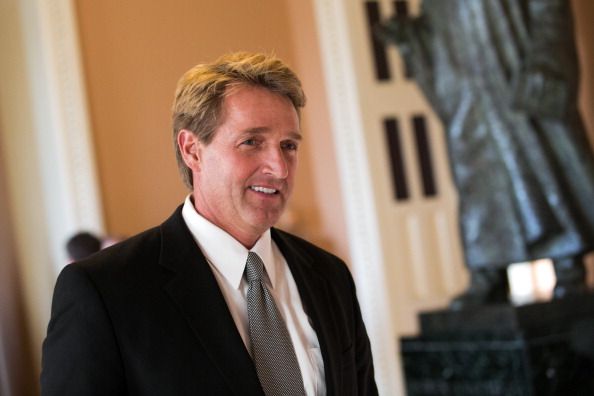 GOP Sen. Jeff Flake of Arizona chastised his fellow Republicans for threatening Hillary Clinton with prison.