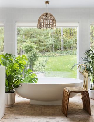 monstera plant in white bathroom by Sarah Sherman Samuel