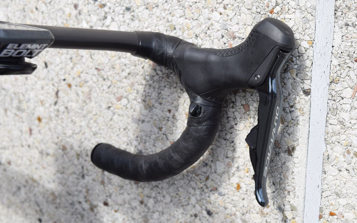The three-time world champion opts for satellite sprint shifters on his handlebar drops