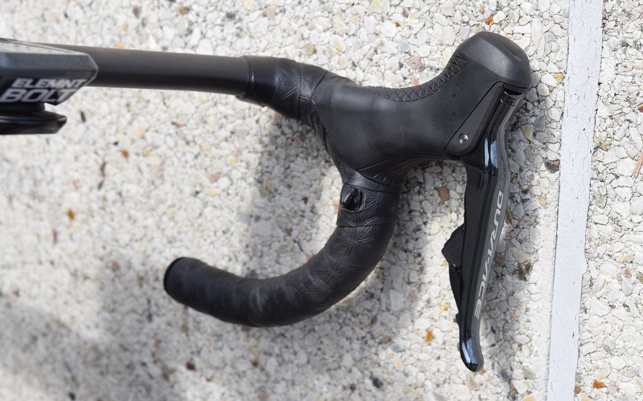 The three-time world champion opts for satellite sprint shifters on his handlebar drops