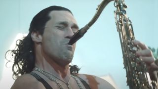 Jon Hamm as Sergio playing the saxophone in "The Curse" on SNL