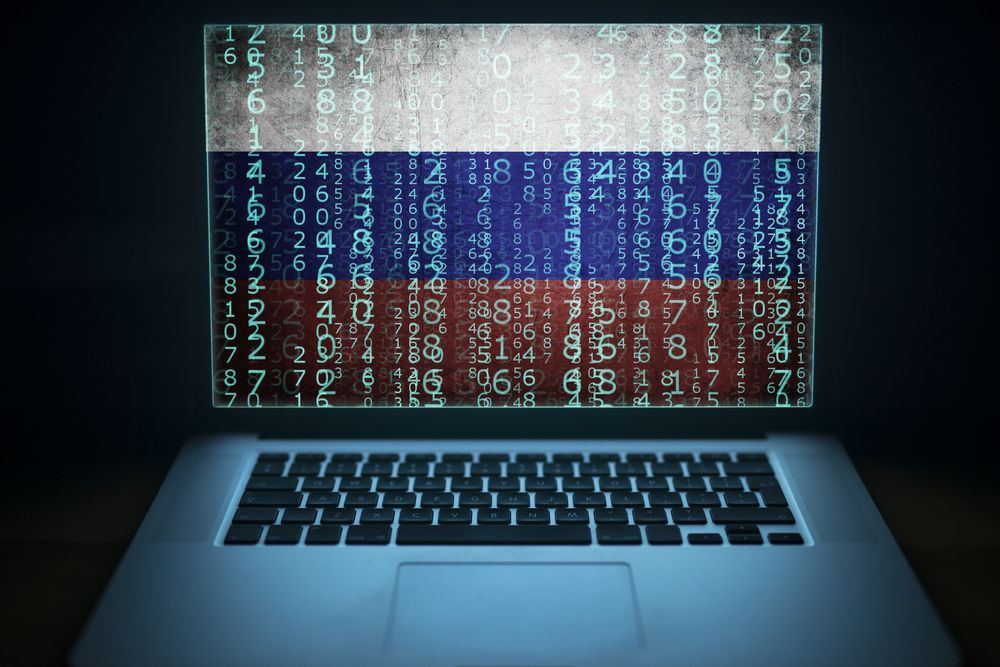 A computer with data overlaid onto the Russian flag