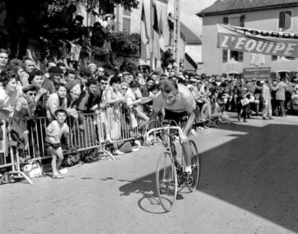 Jacques Anquetil, wearing the yellow jersey, rides to victory on the 19th stage