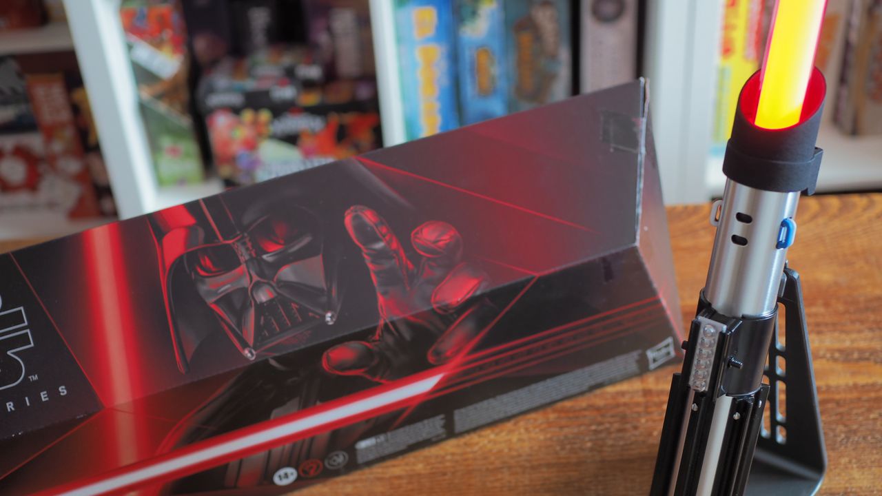 A closeup look at the Darth Vader Force FX Elite Lightsaber on a wooden table