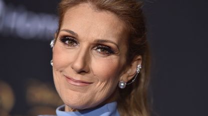 celine dion on a dark background