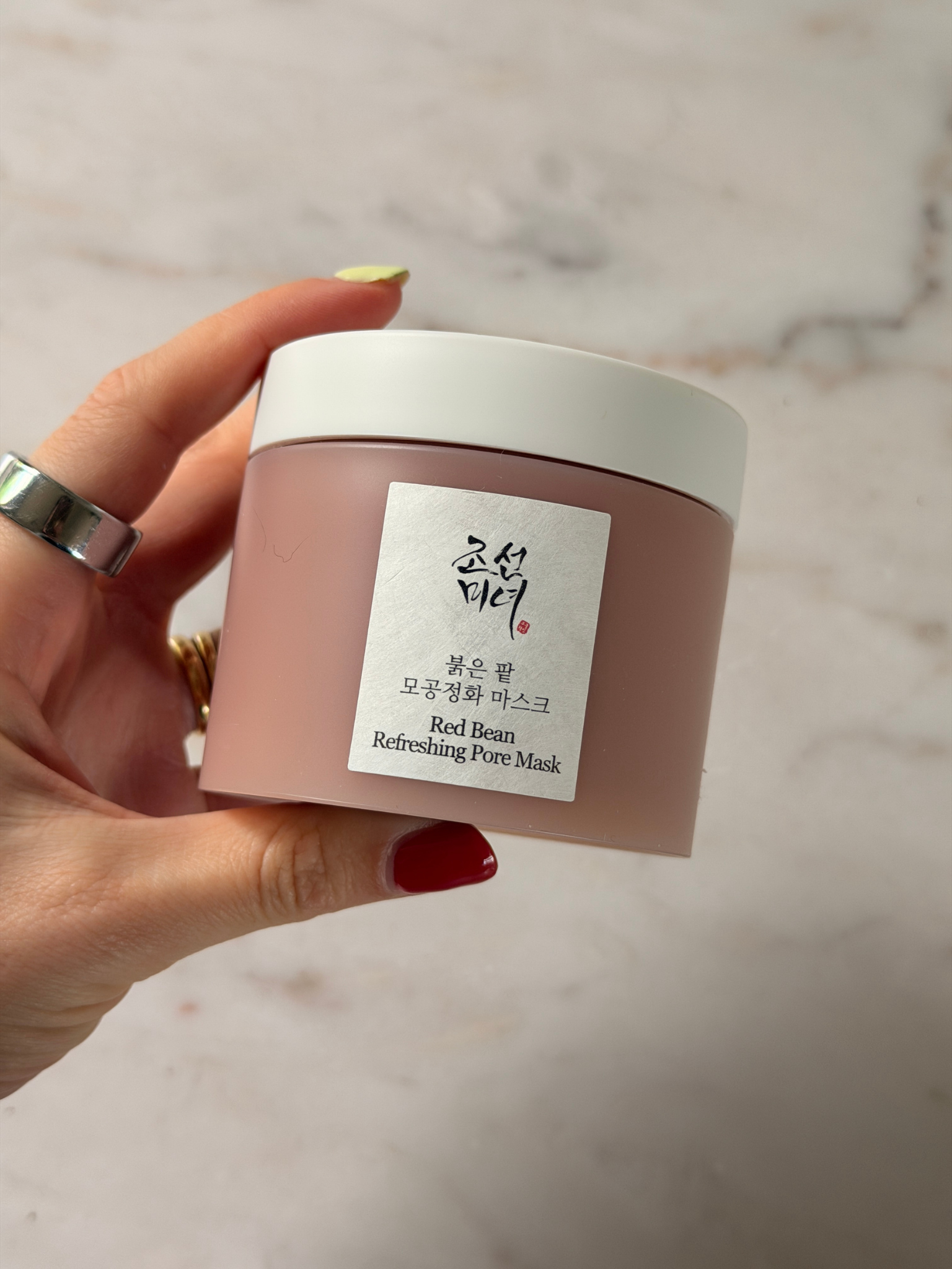 Freelance beauty editor Grace Day holding the Beauty of Joseon face mask