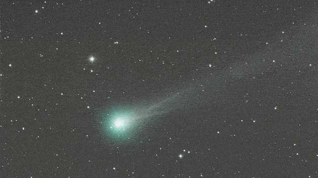Looped video footage of the comet moving across the night sky as its tail if buffeted by solar wind