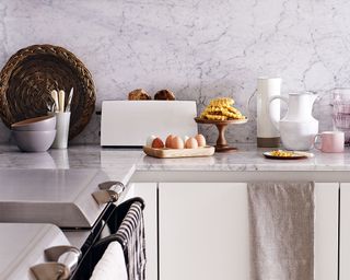 kitchen with marble countertops and crockery