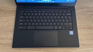 Samsung Galaxy Chromebook Go review: laptop keyboard on wooden table