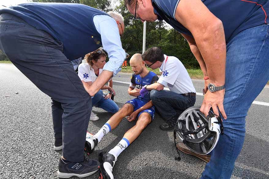 Tom Boonen is treated after crashing on stage 4 of the Eneco Tour.