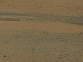 This color image from NASA's Mars rover Curiosity looks south toward Mars' huge Mount Sharp. This is part of a larger, high-resolution color mosaic made from images obtained by Curiosity's Mast Camera on Aug. 8, 2012.