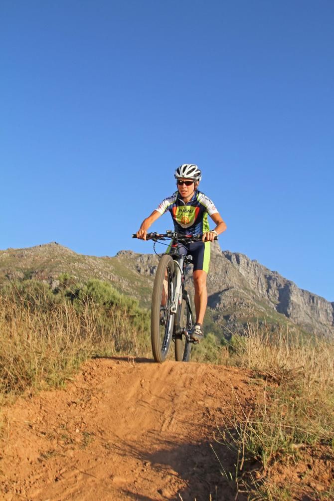 Hanlie Booyens of Team Pragma Orange Monkey's on the bike preparing for the Cape Epic.