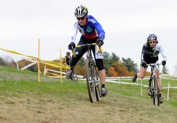 Andrea Smith (Ladies First Racing) leads Sara Bresnick-Zocchi (crossresults.com p/b JRA Cycles) into the barriers.