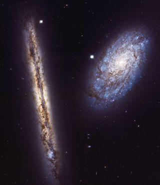 In celebration of the 27th anniversary of the launch of NASA's Hubble Space Telescope on April 24, 1990, astronomers used the legendary telescope to take a portrait of a stunning pair of spiral galaxies. The edge-on galaxy is called NGC 4302, and the tilted galaxy is named NGC 4298.