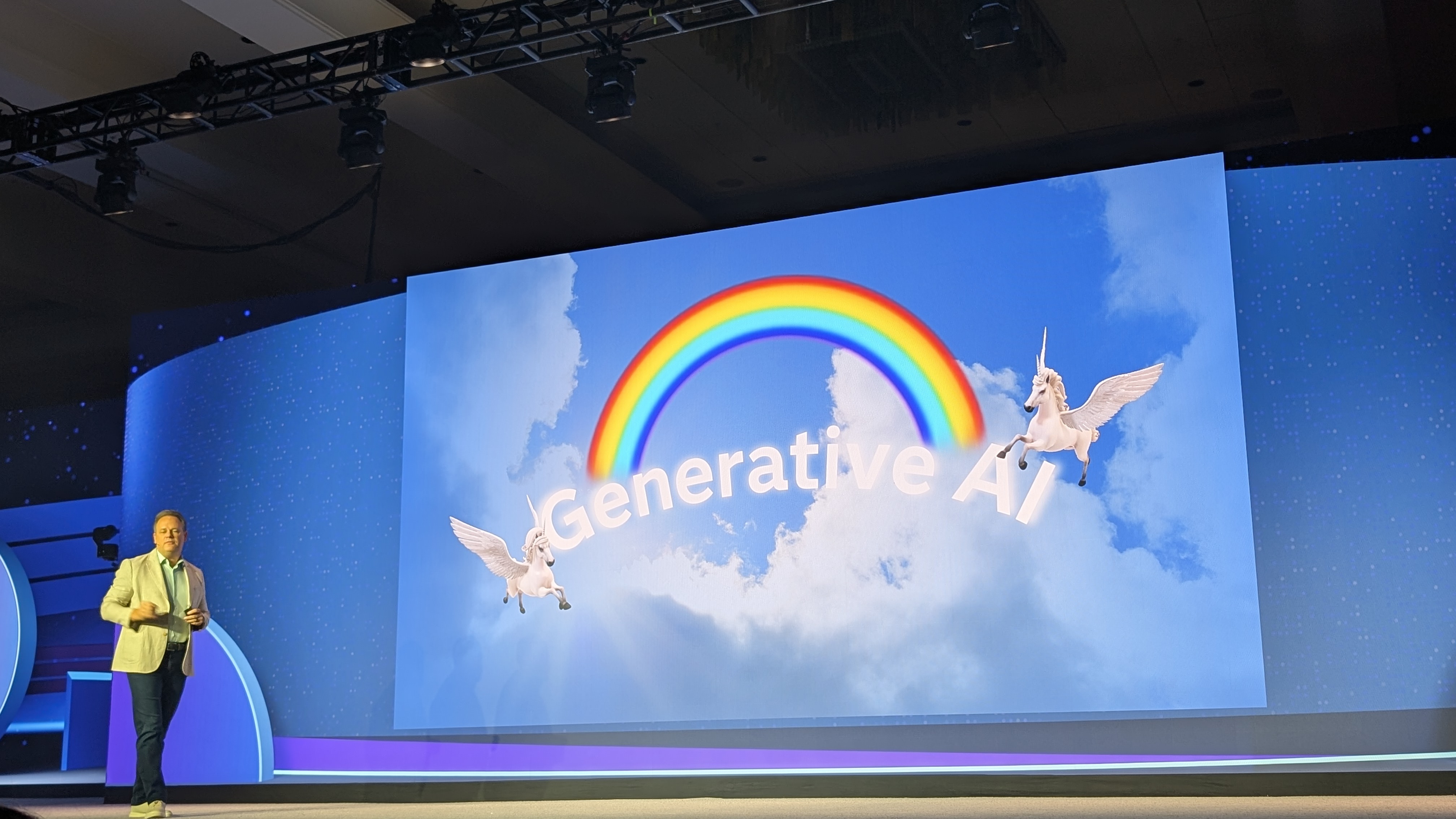 Bryan Harris, Chief Technology Officer, onstage at SAS Innovate 2025 in front of a large screen showing pegasi and a rainbow in with the text 