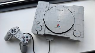 Lego PlayStation model on a window stool
