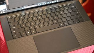 Top down photo of the Dell XPS 15 (9530) open to show the full keyboard and trackpad