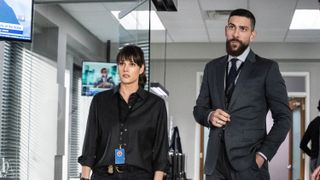 Missy Peregrym as Special Agent Maggie Bell and Zeeko Zaki as Special Agent Omar Adom ‘OA’ Zidan standing next to each other in FBI season 6