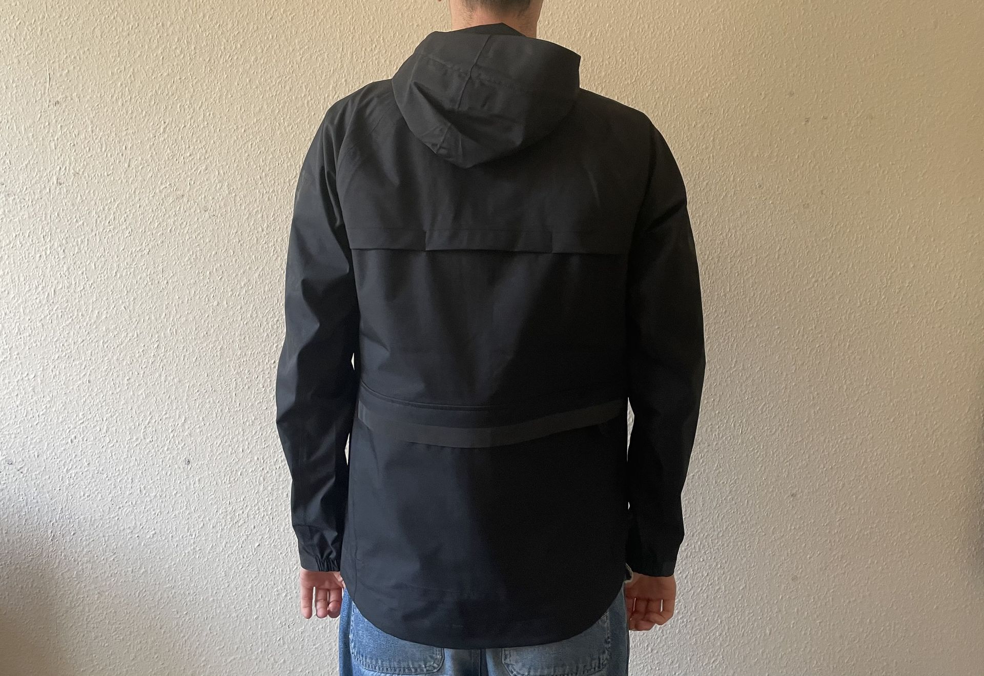 Person wearing black Chrome Storm Salute Commute Jacket