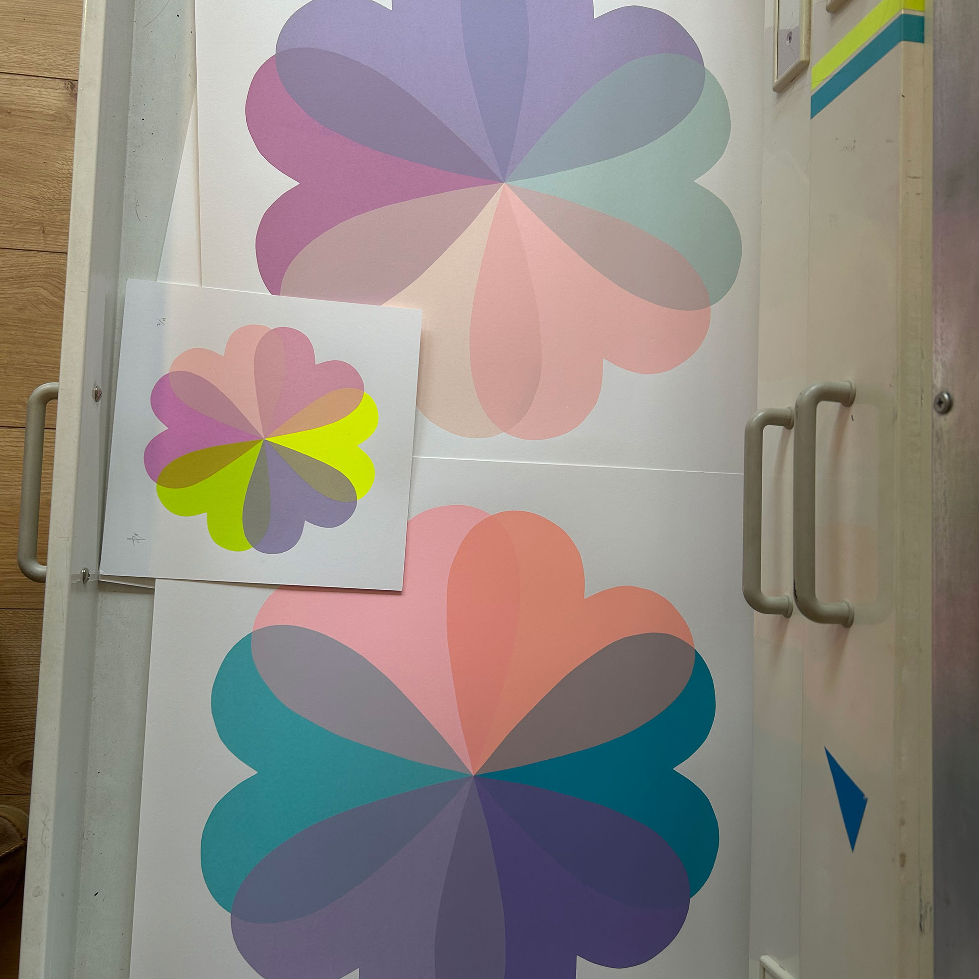 Drawer full of screen prints of flowers made up of heart shapes