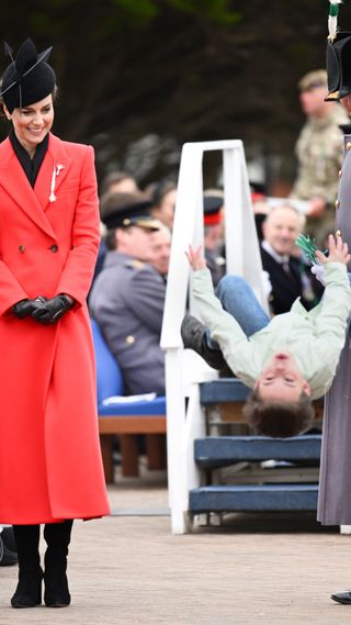 Catherine, Princess of Wales watches a young boy do a backflip during a visit to the 1st Battalion Welsh Guards with Prince William, Prince of Wales at Combermere Barracks for the St David’s Day Parade on March 01, 2023 in Windsor, England.