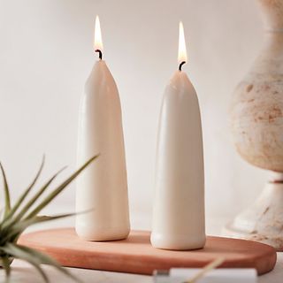 two cream chubby standing taper candles