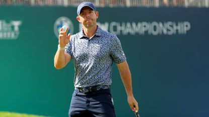 Rory McIlroy of Northern Ireland reacts after making par on the 18th green during the first round of the BMW Championship