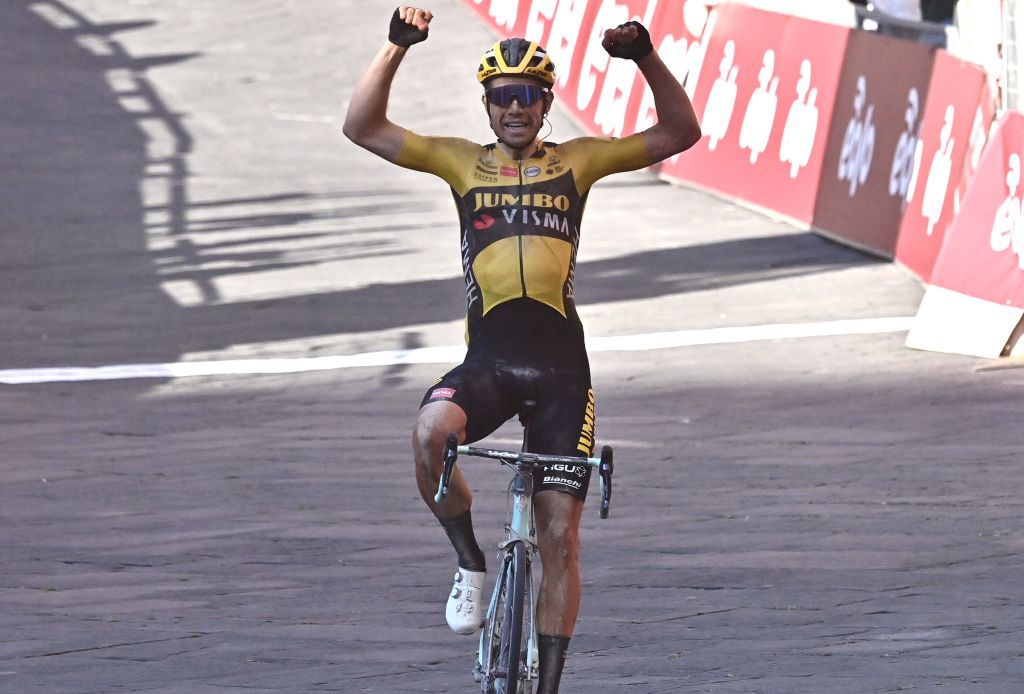 Team JumboVisma Belgian rider Wout van Aert celebrates as he crosses the finish line to win the oneday classic cycling race Strade Bianche White Roads on August 1 2020 in Siena Tuscany Photo by Marco BERTORELLO AFP Photo by MARCO BERTORELLOAFP via Getty Images