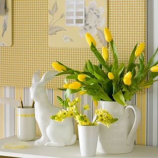 white easter bunny with yellow flower vase