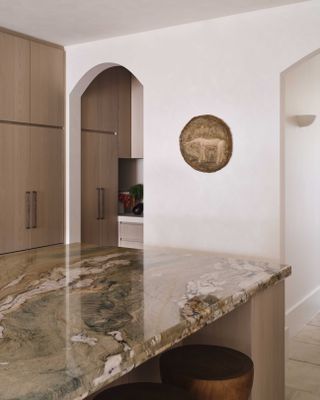 A kitchen with limewash walls