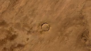 Tenoumer crater is a near-perfect circle.