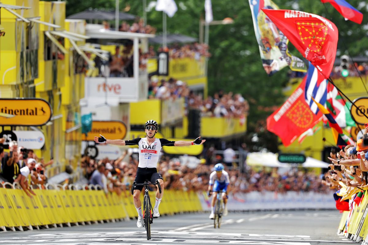 Adam Yates pips twin brother Simon to stage win and yellow jersey on